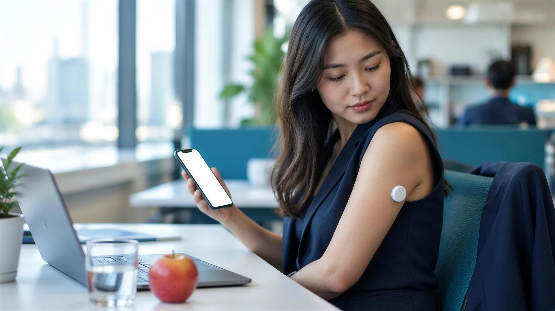 Person checking blood glucose levels at work with diabetes management device